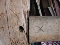 Marriage marks, here the Roman numeral X, were used by early craftsmen to label the timbers in preparation for the barn's  first raising, circa 1780.